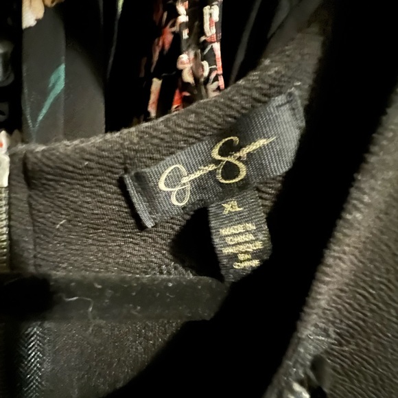 Black short Jessica Simpson dress with attached stones at neckline. - Picture 3 of 3